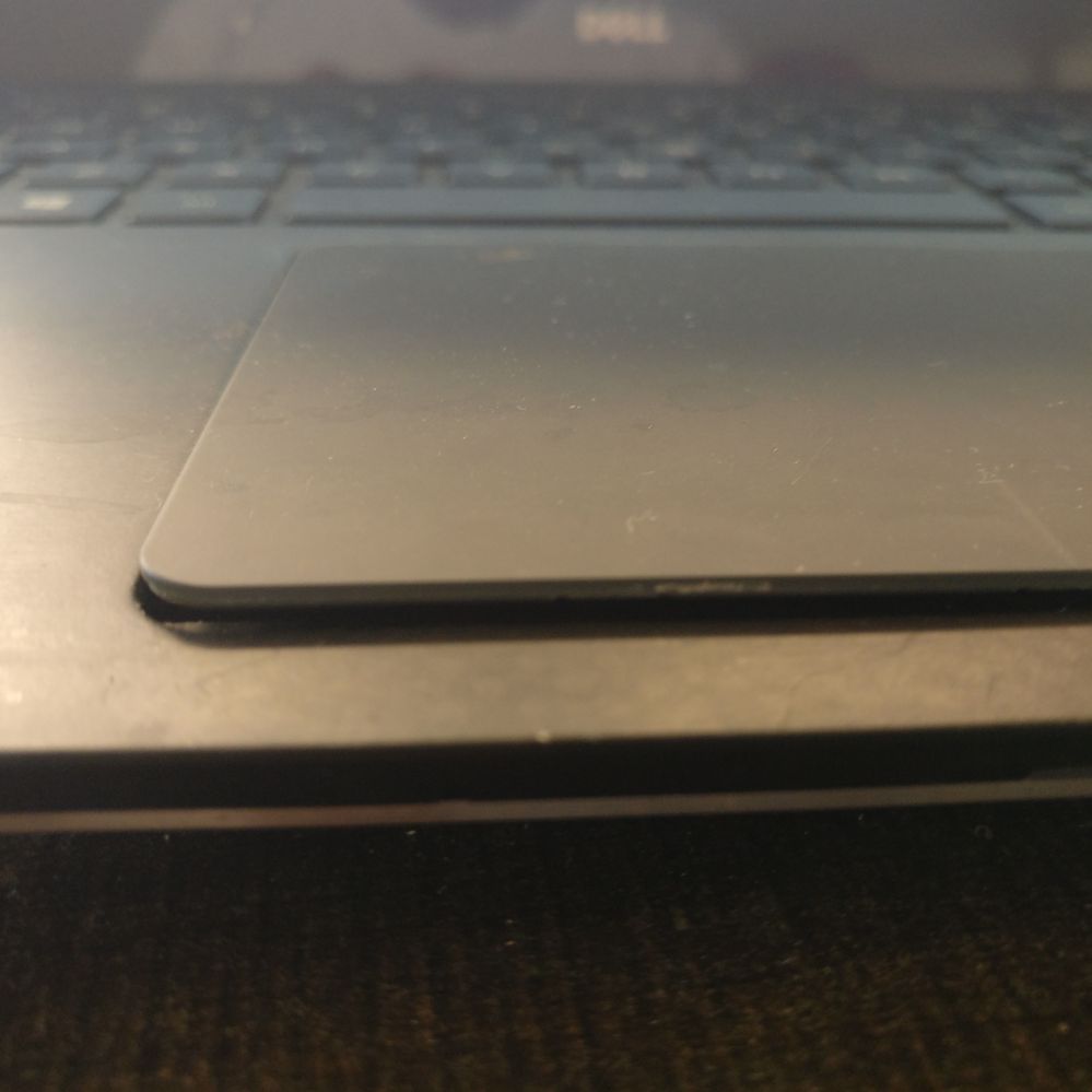 xps 15 9560 touchpad popping out
