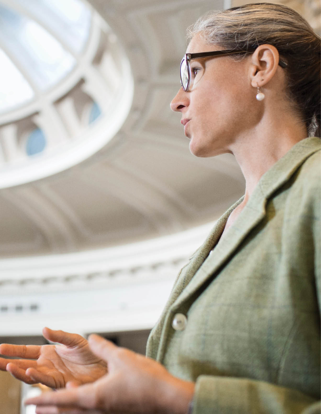 Caucasian politician talking in government building 