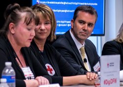 Three people speaking at the opening of the American Red Cross Digital Operations Center in Dallas, TX