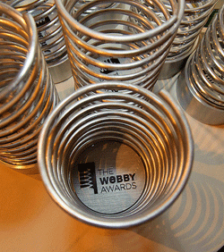 Photo of several Webby awards sitting on a table
