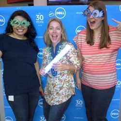 Three Dell employees celebrate the company's 30th anniversary
