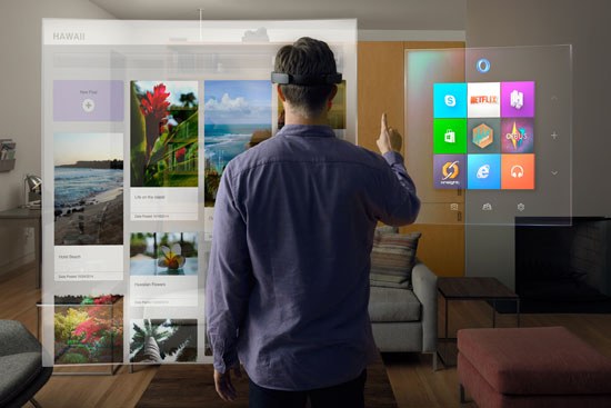  A man stands in his living room using Microsoft HoloLens enabled by Windows 10.
