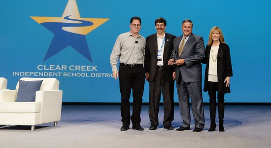 From left to right: Michael Dell; Kevin Schwartz, chief technology officer, Clear Creek Independent School District; Greg Smith, Ph.D., superintendent of schools, CCISD; and Karen Quintos, chief marketing officer, Dell, celebrate CCISD’s selection as People’s Choice winner in the inaugural Dell World Impact Awards. 