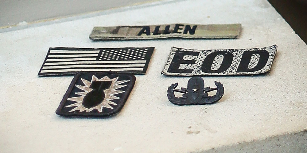 collection of military patches displayed on a flat surface