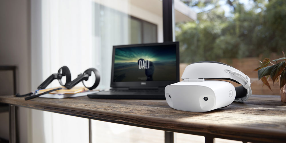 dell mixed virtual reality visor headset on a desk with a laptop and controllers