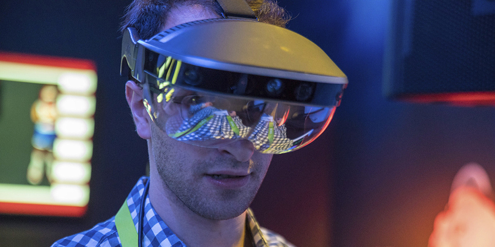 Man wearing a Microsoft mixed reality headset at a Dell event