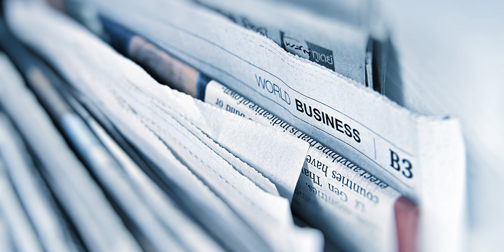 Newspaper business section Photo by G. Crescoli on Unsplash