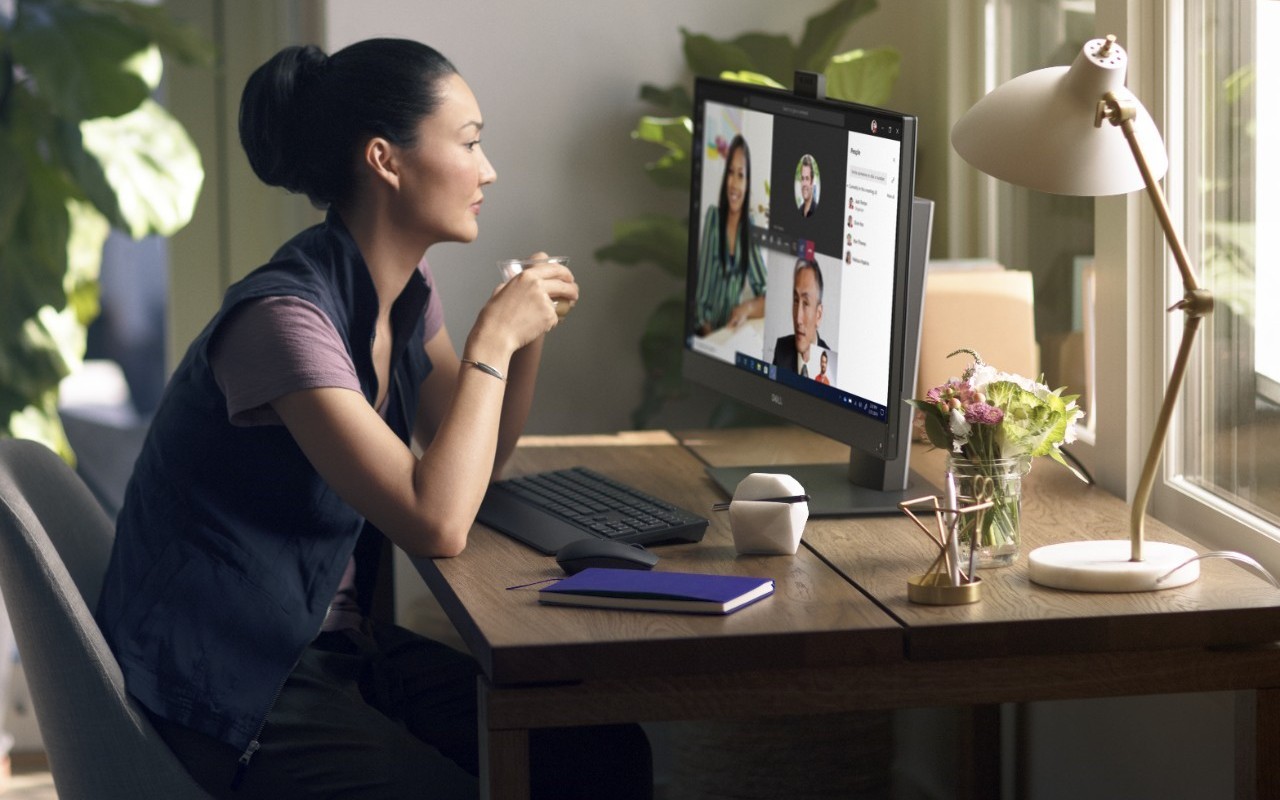 Woman participating in video conference on her Dell system.