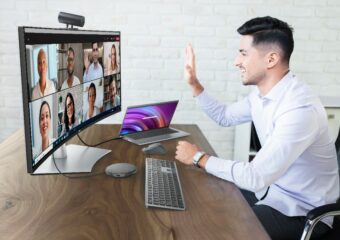Man taking part in video conference with Dell UltraSharp Webcam.