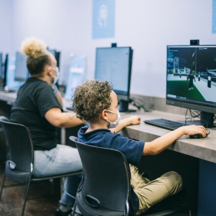 Woman and child using Dell Optiplex Ultra workstations at a new ATT Connected Learning Center