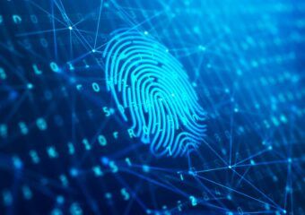 Scanned fingerprint against a digital background, representing biometric security.