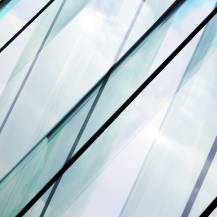 Close up view of glass contemporary office building.
