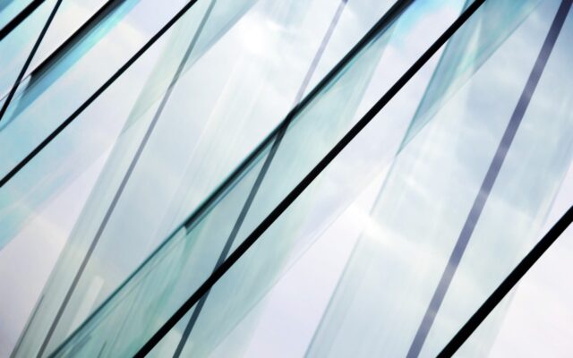 Close up view of glass contemporary office building.
