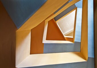 Abstract architectural image with unusual geometric shaped passages.