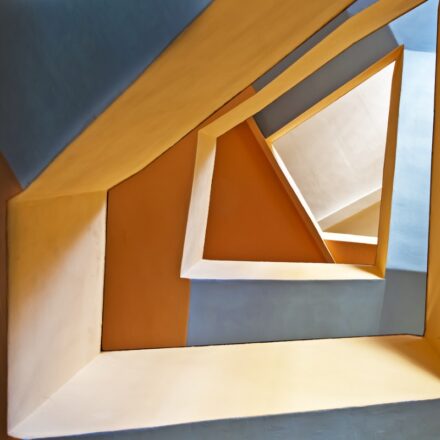 Abstract architectural image with unusual geometric shaped passages.