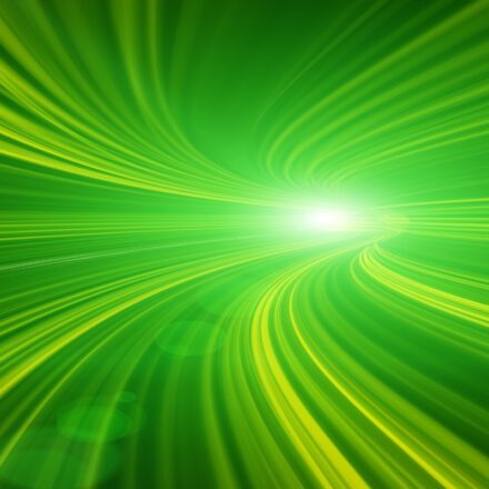Abstract image in green of light moving in high speed tunnel.