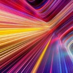 Spectrum of light rays in various colors in kinetic motion, bending upwards the image's background.