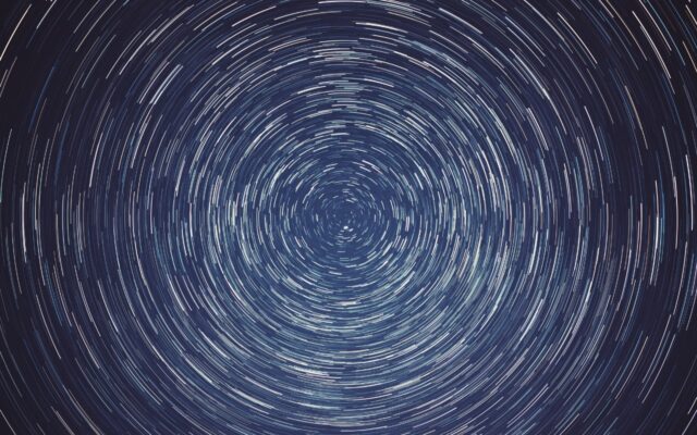 Time lapse photo of stars rotating around Polaris, the North Star, in the Northern Hemisphere.