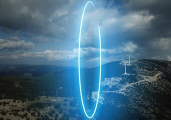 Thin blue ring standing vertically over landscape, representing 5G's capacity.
