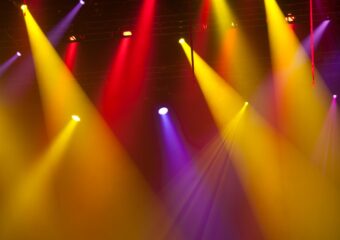 Event show spotlights, in red, yellow, and purple.