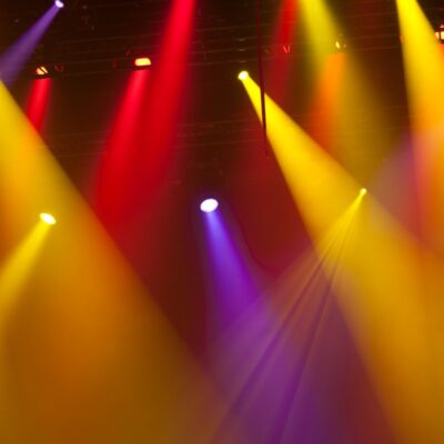 Event show spotlights, in red, yellow, and purple.