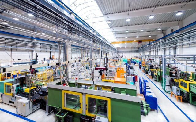 Interior of a plastics fabrication plant utilizing robotics and smart factory technology.