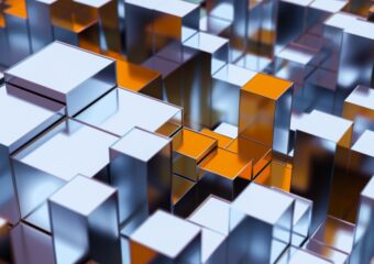Abstract digital image of geometrics cubes of silver, white, blue, and copper of varying heights and sizes