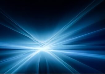 Bright white and blue light emanating rays in various directions against a dark background.