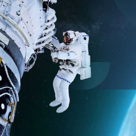Astronaut in an EVA suit outside their spacecraft, working on mission payload project. Image has textured pattern subtly overlaid.