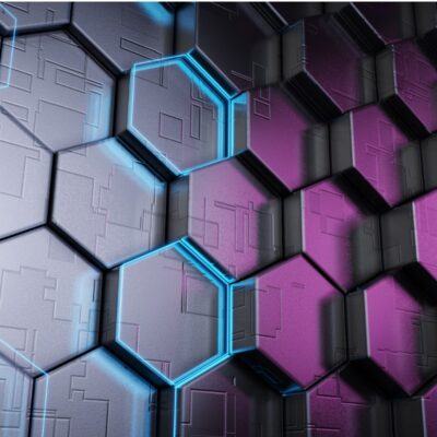 Digitally generated image of hexagons, gray on the left and purple on the right. Two gray hexagons in the center are outlined in a blue light on their edges.