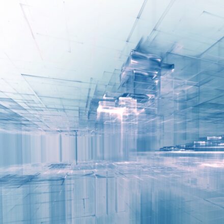 Digitally generated image of a virtual city's architecture, in muted blues and white hues.
