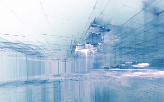 Digitally generated image of a virtual city's architecture, in muted blues and white hues.