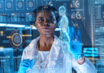 Female African-American physician analyzes patient data on state-of-the-art HUD graphics display.