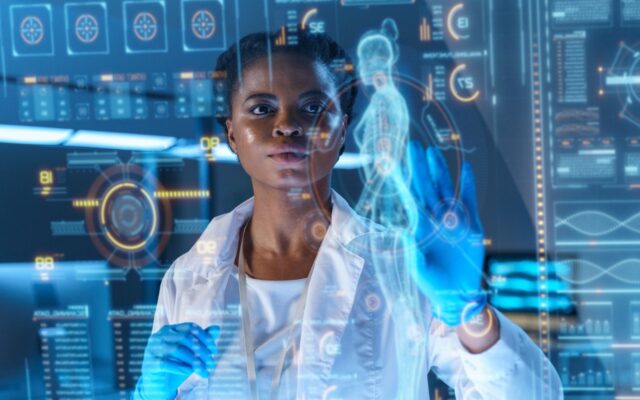 Female African-American physician analyzes patient data on state-of-the-art HUD graphics display.