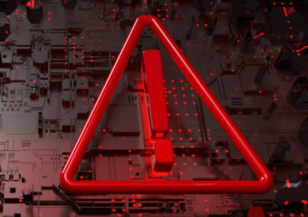 Cybersecurity alert symbol in red.