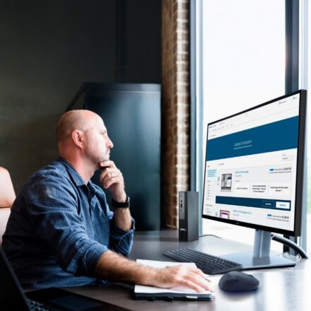 Man staring at dell monitor right-facing