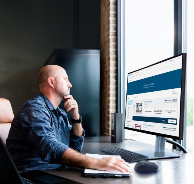 Man staring at dell monitor right-facing