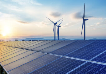 image of solar panels and wind turbines